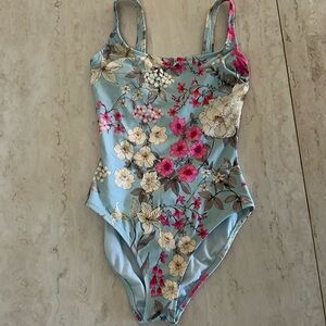 Jonny was bathing suit was beautiful sky blue with flowers flowers